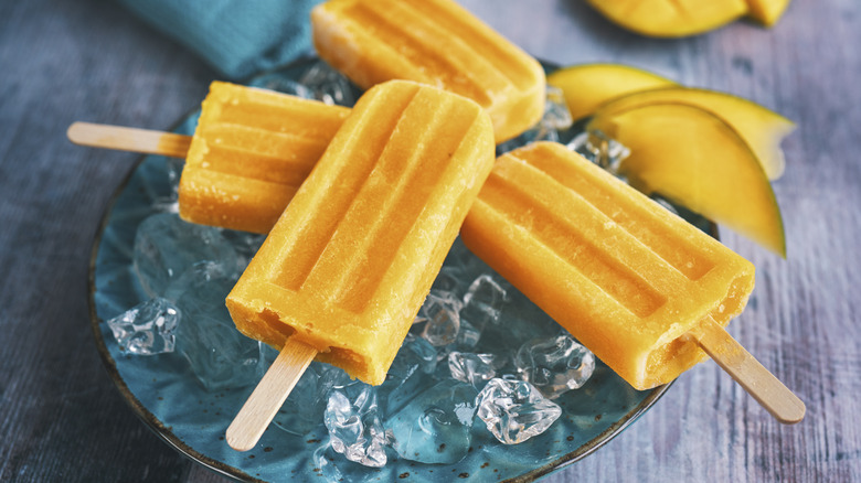 popsicles and ice on plate