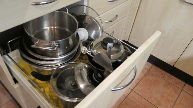 Cookware stored in drawer