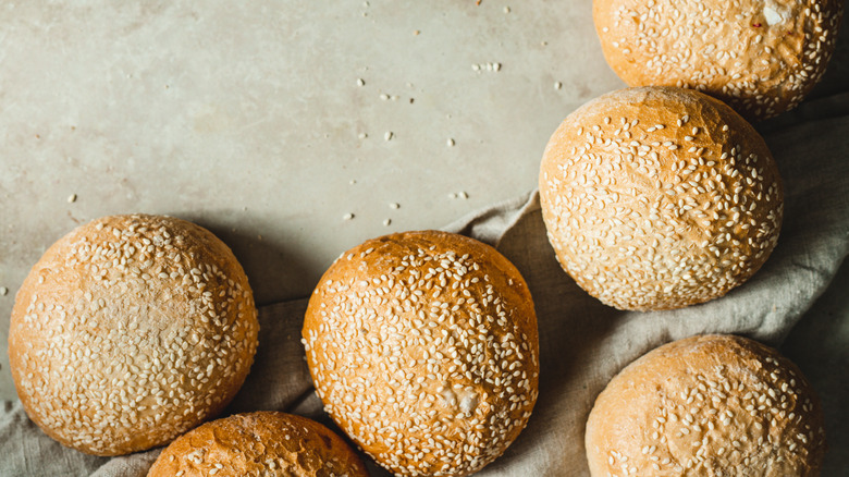 Sesame buns on table