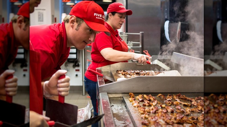 Five Guys cooks making bacon