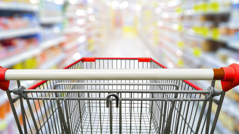 Empty grocery cart in aisle