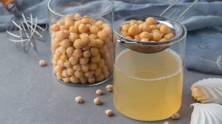 strainer removing aquafaba from chickpeas 