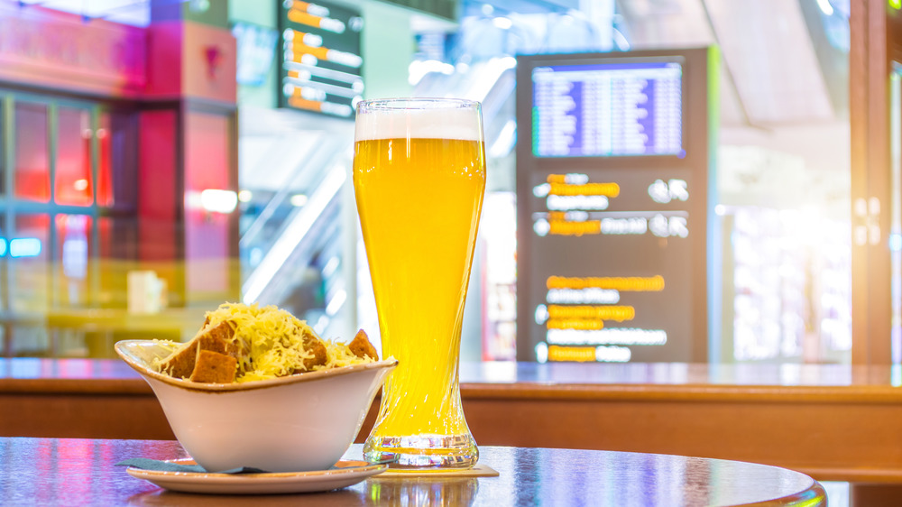 pint and food at an airport pub