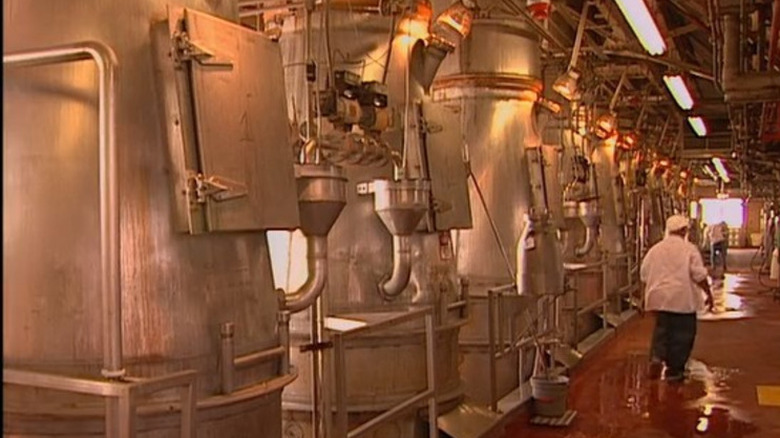 Man walking through Heinz ketchup factory