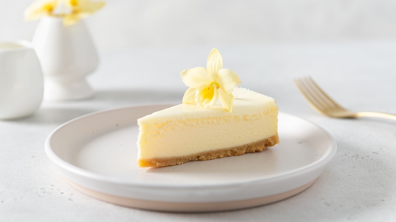 Vanilla cheesecake with flower and fork