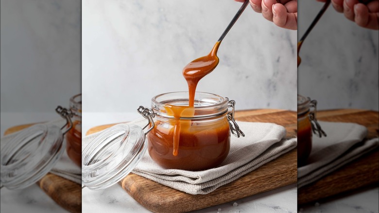 Caramel sauce spooned from jar