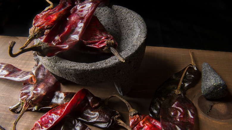 dried chiles and a mortar