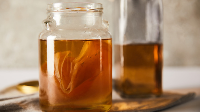 Jar of kombucha with scoby