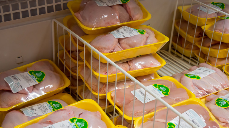 Pre-packaged chicken in a freezer