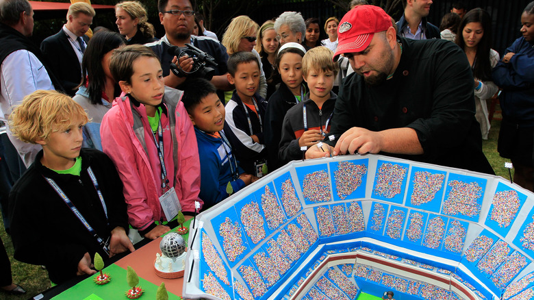 Duff Goldman works on a stadium cake