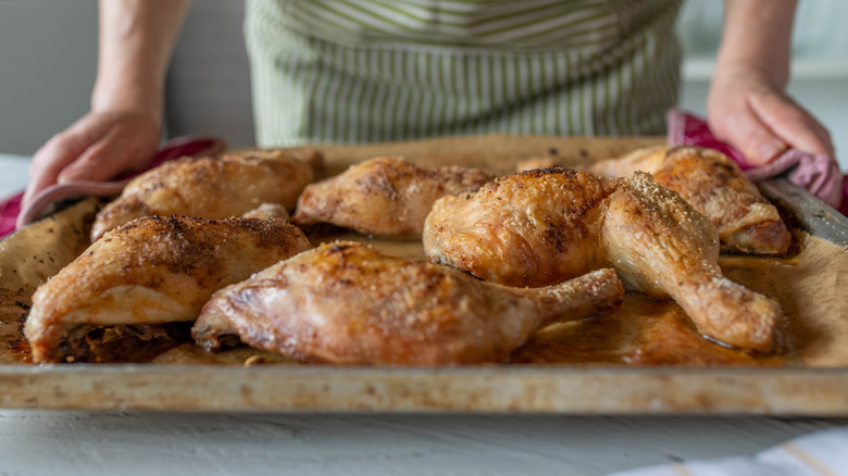 Chicken thighs on cooking sheet