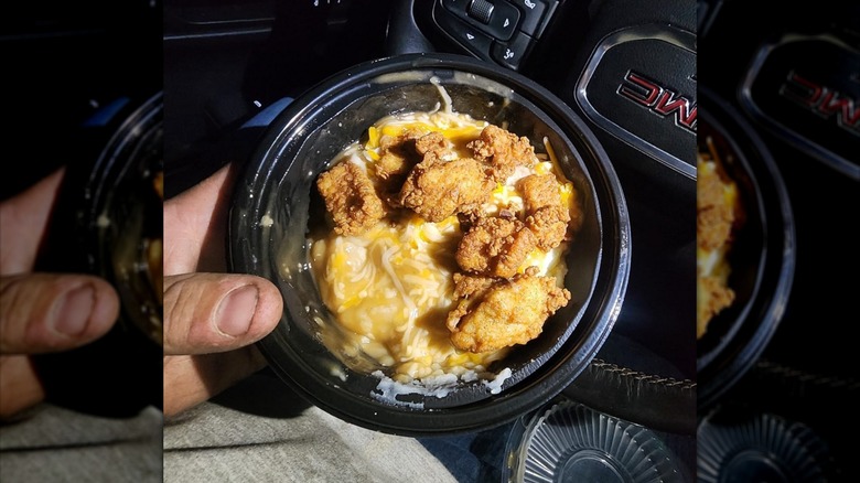 Person holding KFC Famous Bowl