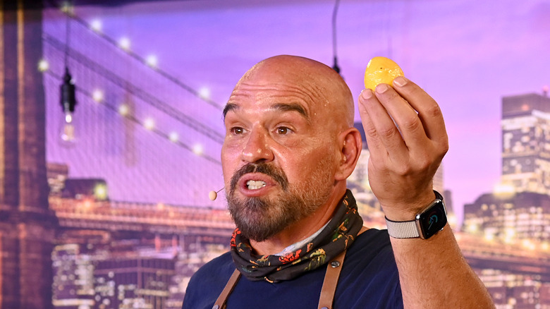 Michael Symon holding a lemon