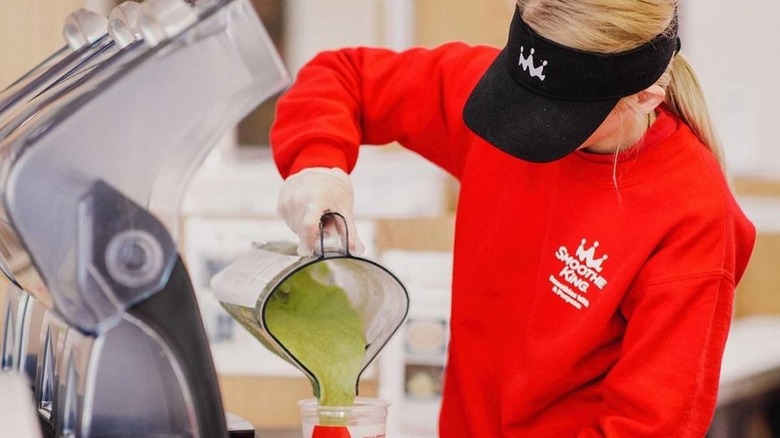 Smoothie King worker in red uniform