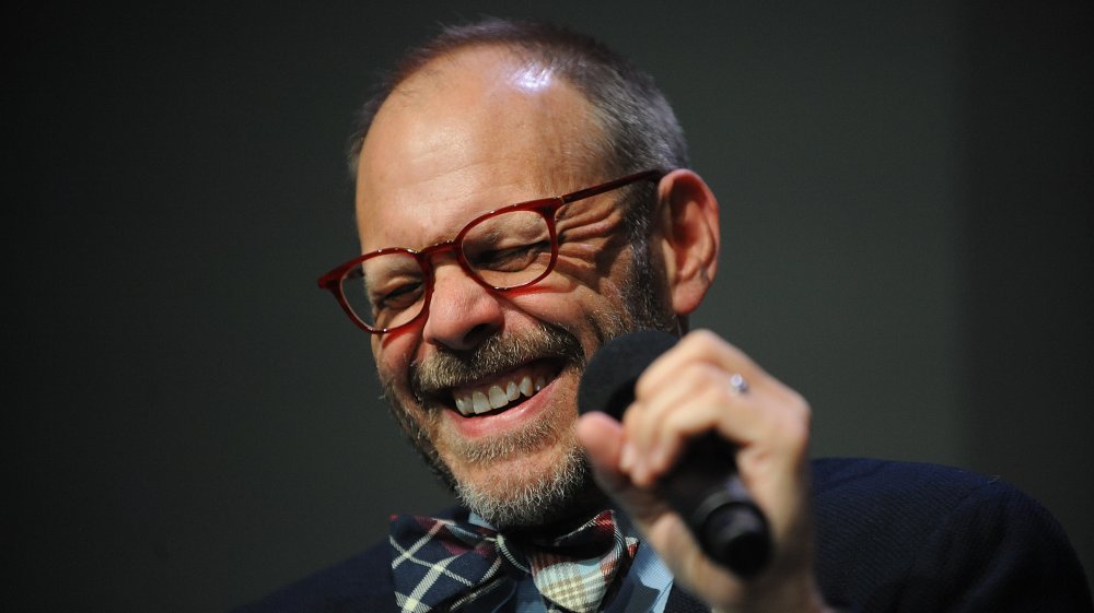 Alton Brown laughing during an event
