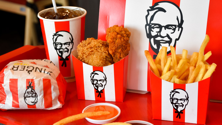 KFC chicken, fries, and soda in containers