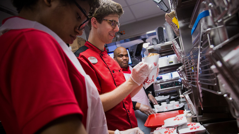 Chick-fil-A workers preparing food