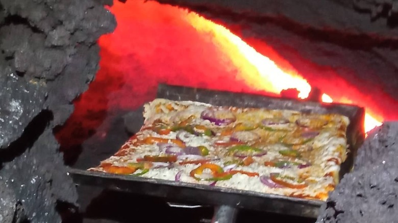 Pizza cooking on lava flow