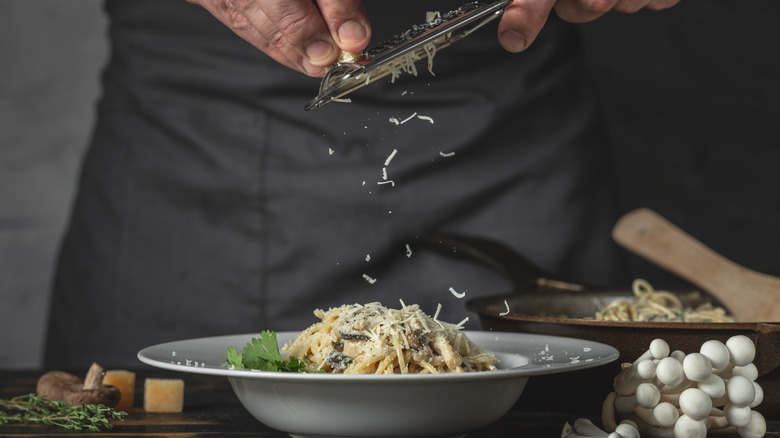 server grating parmesan cheese