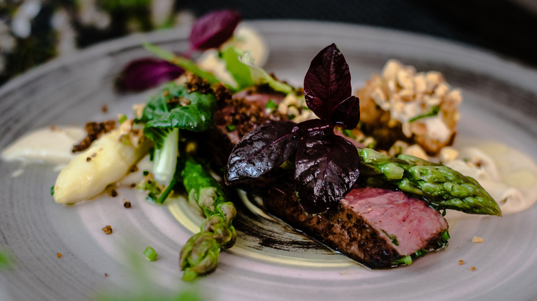 Fancy ostrich meat with asparagus