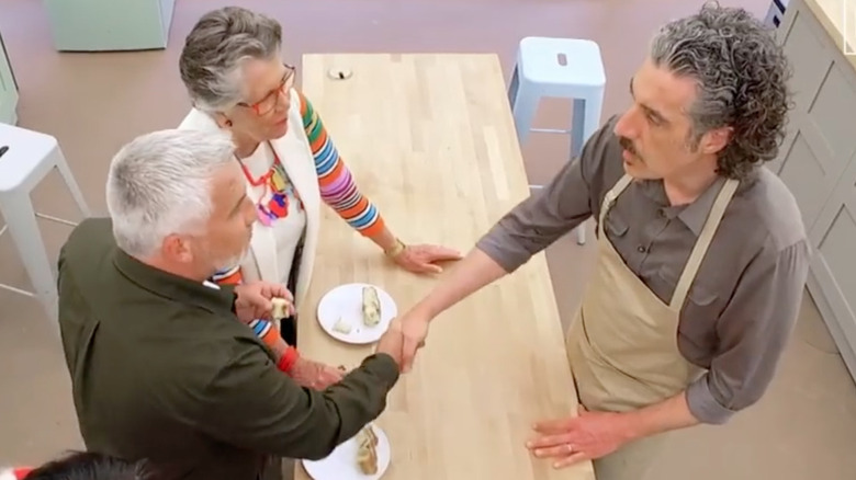 Paul Hollywood shaking Guiseppe Dell'Anno's hand