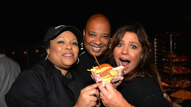 Rachael Ray eating a burger