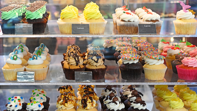 Cupcakes on glass display shelves