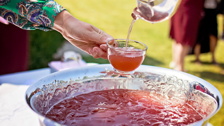 Lady ladling punch from bowl