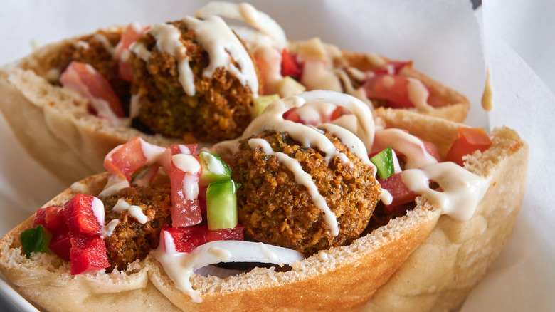 Falafel sandwich with sauce and vegetables