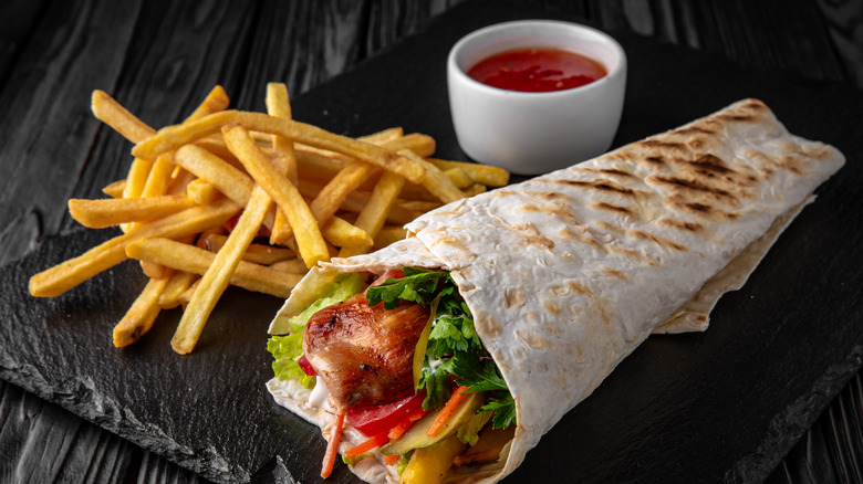 Döner Kebab with ketchup and French fries 