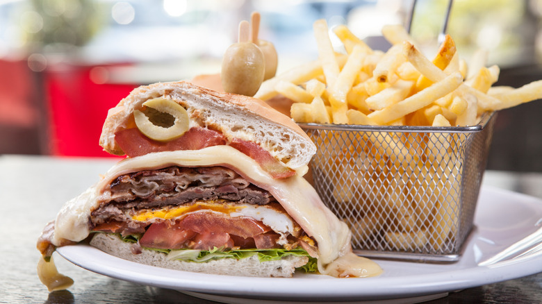 Chivito sandwich with French fries 