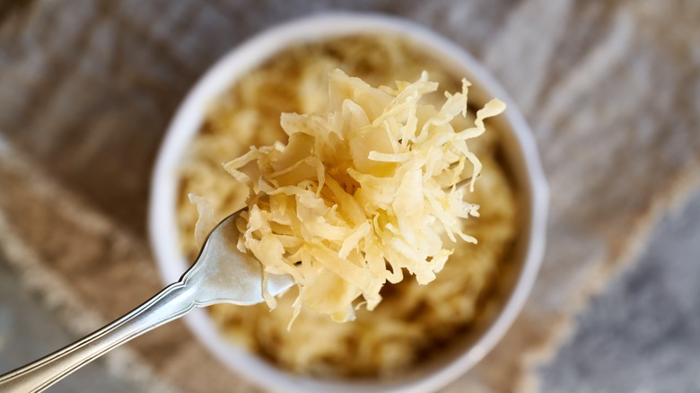 closeup of sauerkraut on fork