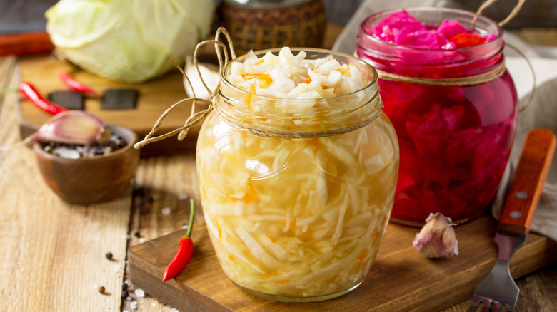 sauerkraut and preserved vegetables in jars