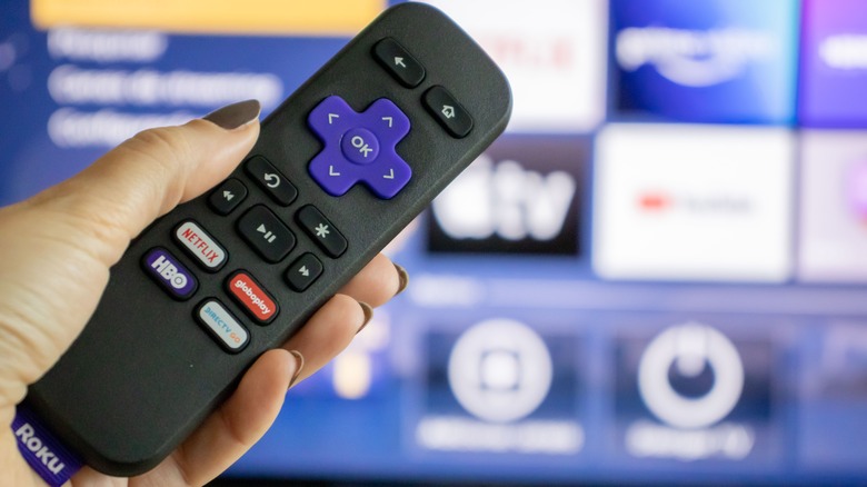 Roku remote in front of screen