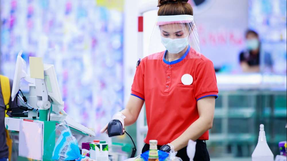 cashier with mask and face shield