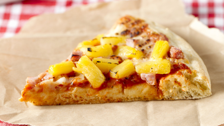 Slice of pizza with pineapple topping