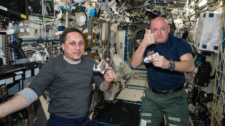 astronauts eating on international space station