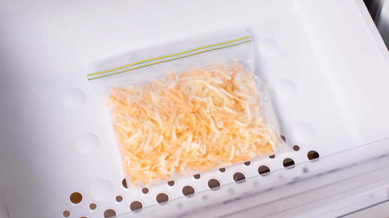 Plastic bag of shredded cheese