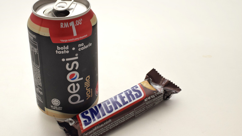 sniskers bar with pepsi can