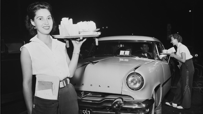 Woman at a restaurant drive-through window