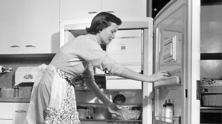 1950s woman at refrigerator