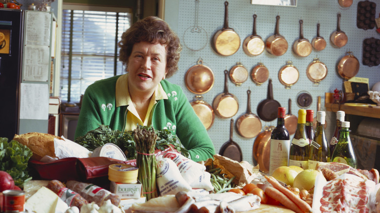 Julia Child in front of food