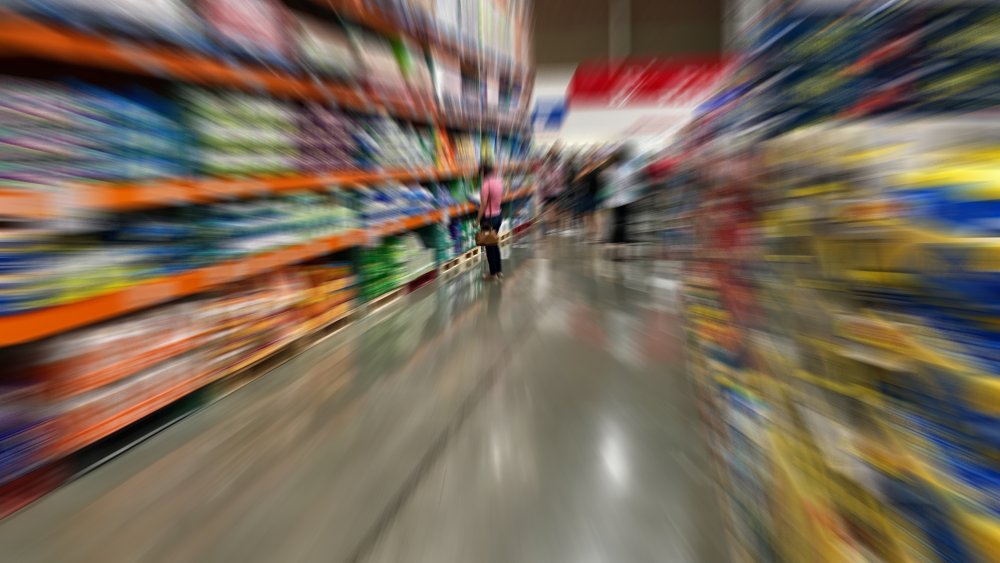 The interior of a Sam's Club blurred to capture the effect of shopping on Black Friday: "Buy! Buy! Buy! Buy! Buy! Buy! Forget the children! Buy!"