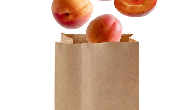 Peaches in a brown paper bag