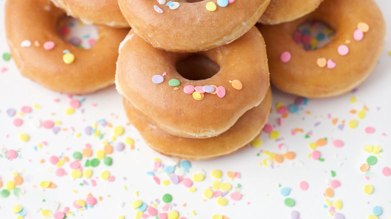 stack of krispy kreme doughnuts with sprinkles