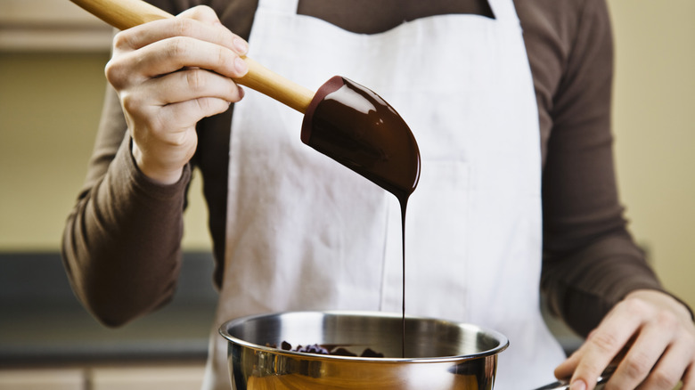 Melting chocolate dripping from spatula