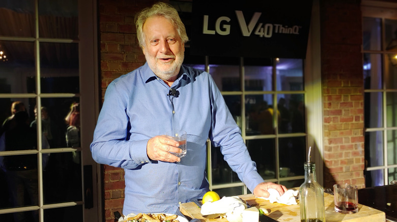 Jonathan Waxman holding a drink