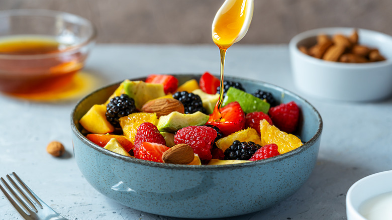 Fruit in bowl with honey