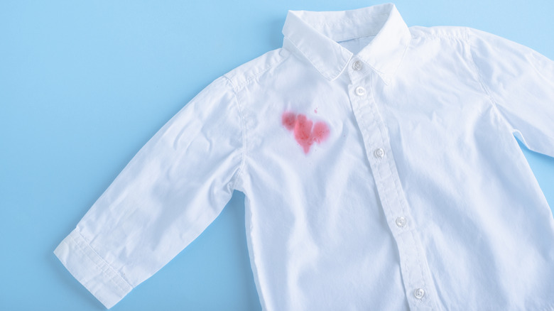 White button-down shirt with stain