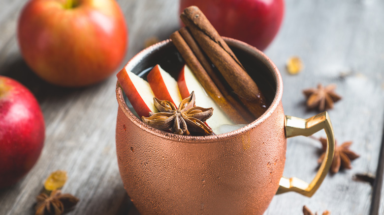 Copper mug with autumnal beverage